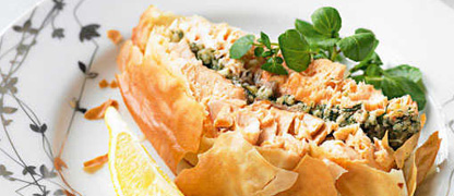 A slice of Salmon and dill pesto en croute