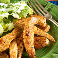 Jerk strips dressed on a green plate